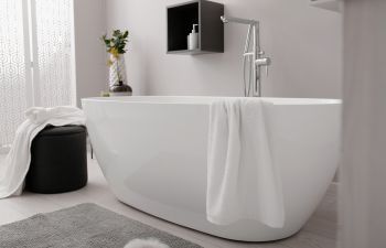 Modern bathroom with a white bathtub.